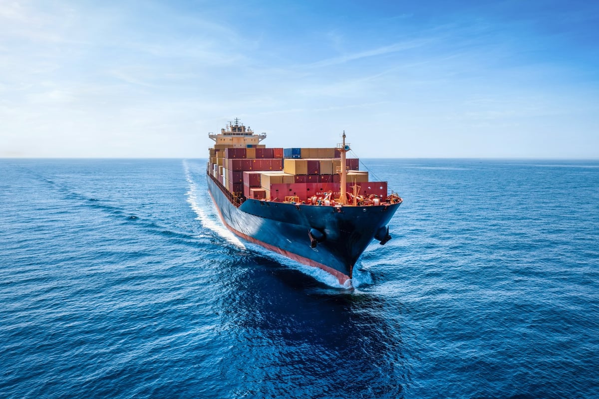 Industrial container cargo ship traveling over ocean