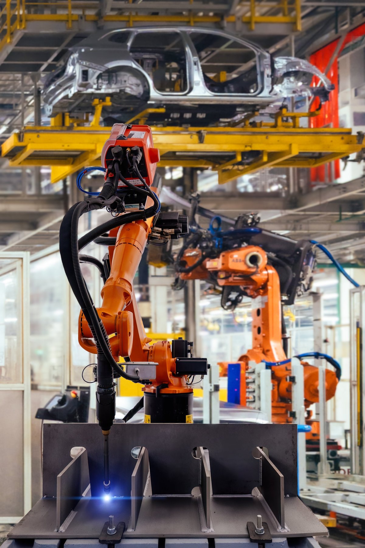 Industrial robot welding metal machine part